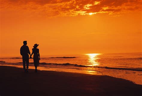 two night sea beach silhouettes sunset couple walking beach sunset ...