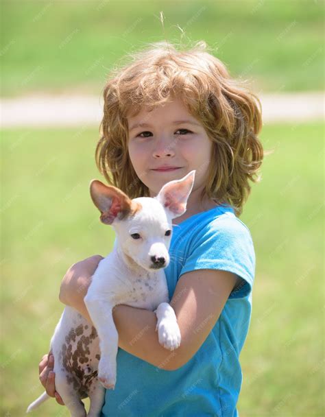 Premium Photo | Close up portrait of cute child hugging dog little boy ...