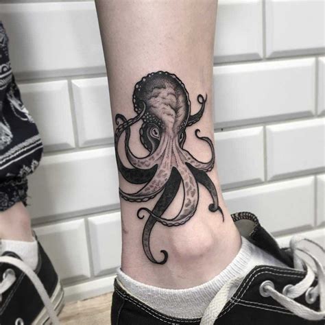 Octopus tattoo on the left shin - Tattoogrid.net