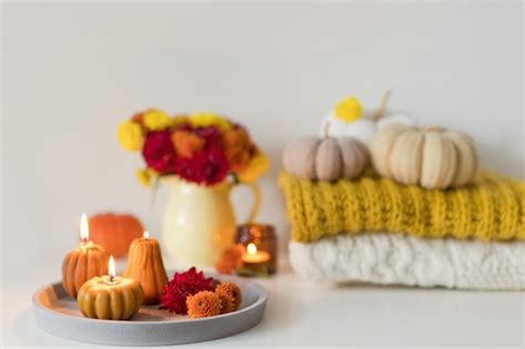 Premium Photo | Cozy autumn mood flowers and candles