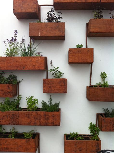 Vertical herb garden | Herb garden wall, Garden wall planter, Garden ...