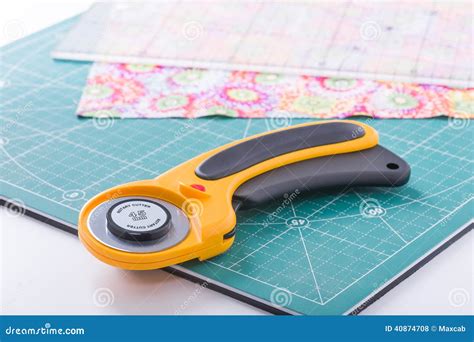 Rotary Cutter on a Green Mat Stock Photo - Image of quilting, equipment ...