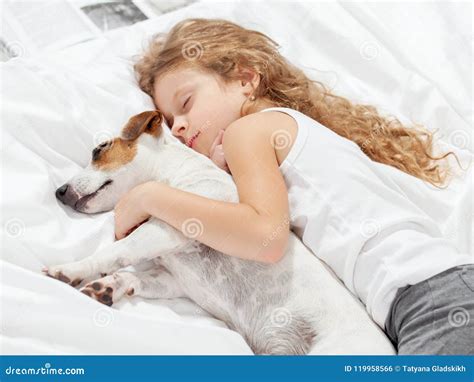 Child Sleeping with Dog on Bed Stock Photo - Image of facial, pets ...