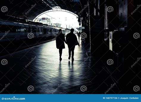 Silhouette of Passengers in a Train Station Stock Photo - Image of ...