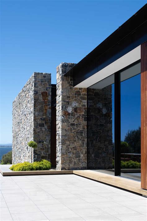 The Stone Walls Found Throughout This House Are Designed To Complement ...