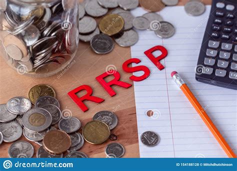 `RRSP` Registered Retirement Savings Plan Signs with Coins in the ...