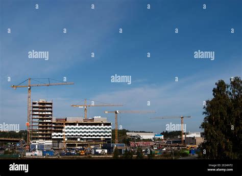 Building cranes on construction site Stock Photo - Alamy