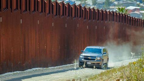 San Diego Border Tests New Wall in the Midst of Crisis That's Creating ...