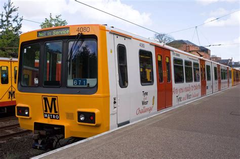 12 photographs of advertising branded Tyne and Wear Metro trains ...