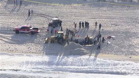 Officials warn bored surfers, beachgoers about dangers of digging giant ...