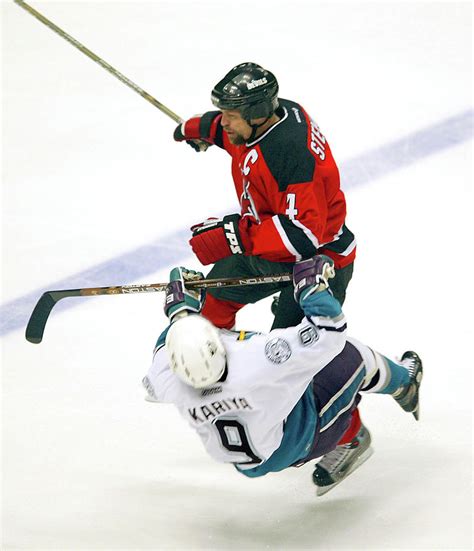 Scott Stevens Hits Paul Kariya by B Bennett