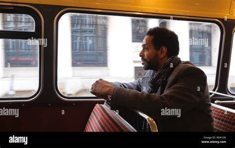 Black Businessman rides a London Bus - LONDON / ENGLAND - DECEMBER 15 ...