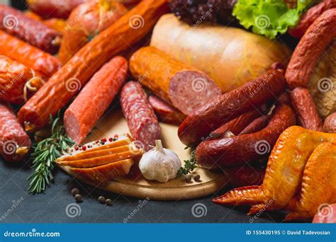 Different Types of Sausages and Meat Products on a Black Background ...