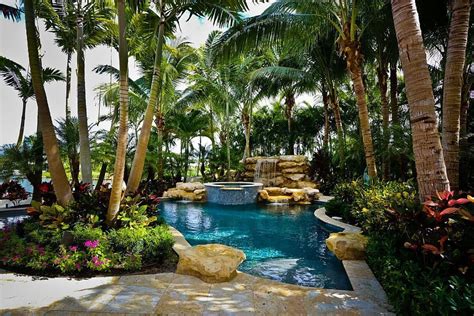 Tropical pool and greenery around it allow you to enjoy a luxurious ...