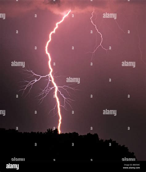 A cloud to ground lightning strike during a severe thunderstorm near ...