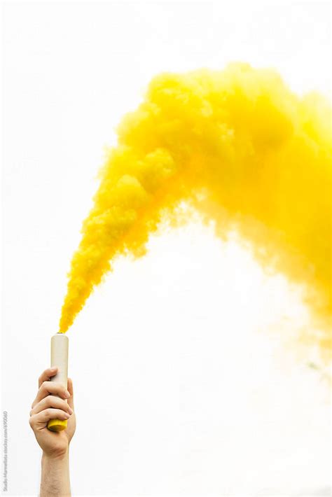 "Yellow Smoke Bomb" by Stocksy Contributor "Studio Marmellata" - Stocksy