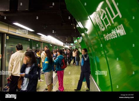 Passengers waiting to board a train at Fortress Hill station on MTR ...