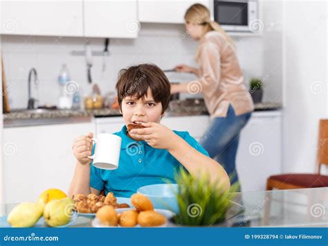 Boy Having Breakfast at Kitchen Stock Photo - Image of childhood ...