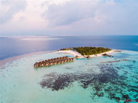 - Aerial view of a tropical island at sunset, Maldives | Royalty Free Image