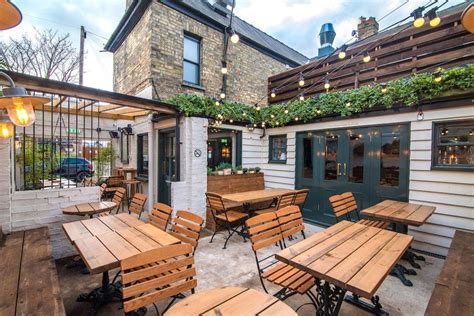 Interior decor inspiration, pub garden terrace with festoon lighting in ...