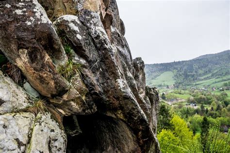 Cave entrance in the rock stock image. Image of cliffs - 147100855