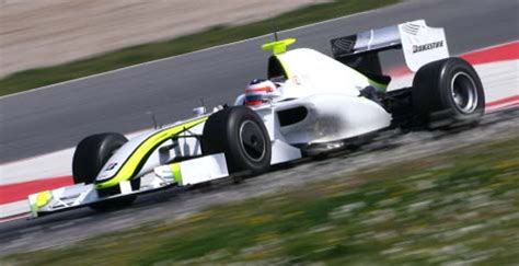 2009 Brawn GP BGP 001 Formula One Car and Driver Photos