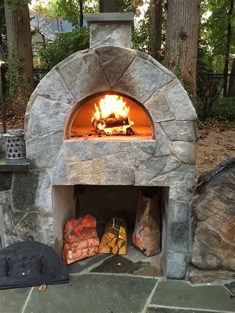 A wood-burning pizza oven is an amazing addition to any backyard space ...