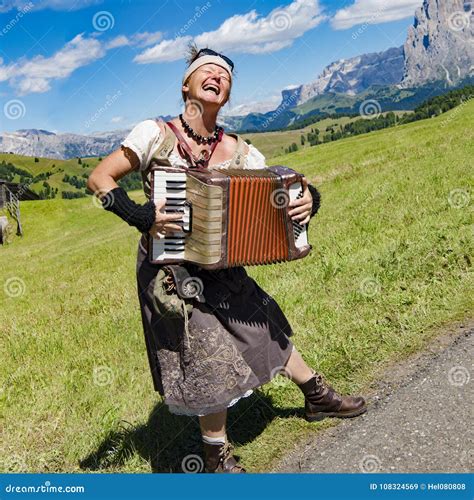 Yodeling in Alps - Musician Singing and Playing Accordion Editorial ...