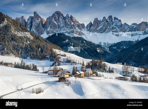 Scenic winter view of Vilnoss or Val di Funes with Puez-Geisler ...