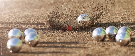 Petanque ball boules bowls on a dust floor, photo in impact. Game of ...