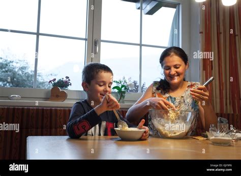 Boy and mom having fun cooking together Stock Photo - Alamy