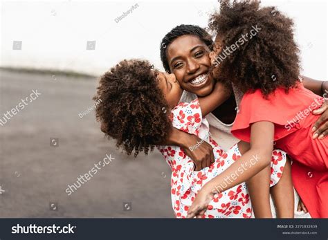 African Sisters Twins Kissing Mother On Stock Photo 2271832439 ...