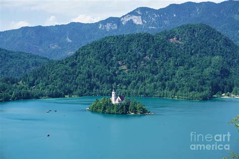 Traditional Pletna boats around Bled island on lake Bled Photograph by ...