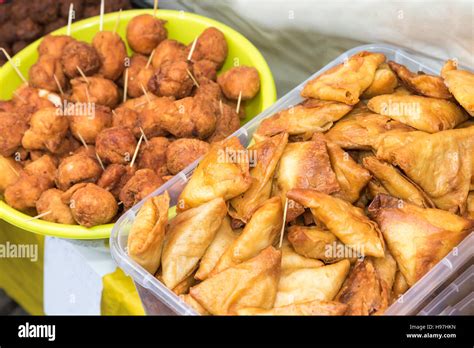 Street food - stuffed pastry and donuts from the Ivory Coast Stock ...