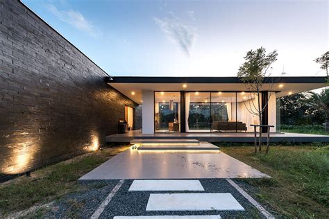 This Open Thai Home with Glass Walls is Encircled by a Flower Garden ...