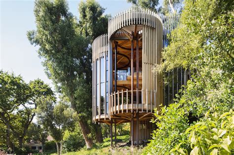 This contemporary treehouse-inspired cabin is a playful composition ...