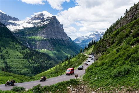 Cars driving the crowded Going-to-the-Sun road in Glacier National Park ...