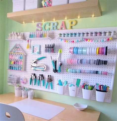 a craft room with pegboard and lots of craft supplies