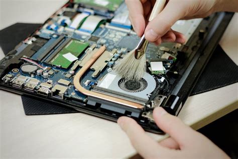 Cleaning the Laptop from Dust with a Brush. Close Up Stock Image ...