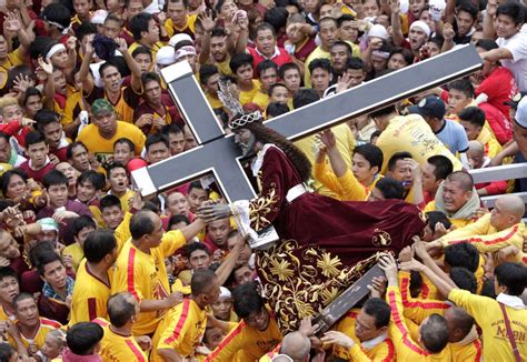 Devotees carry the statue of the Black Nazarene during the start of an ...