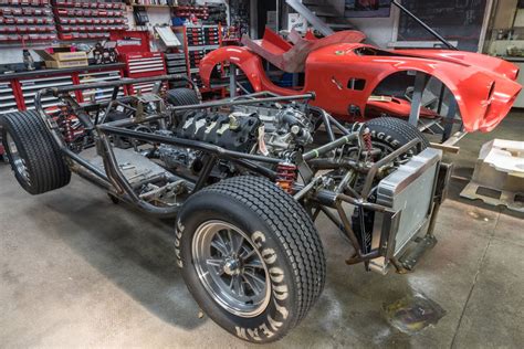 AC Cobra rolling chassis with body nearby | Shelby cobra, Shelby cobra ...