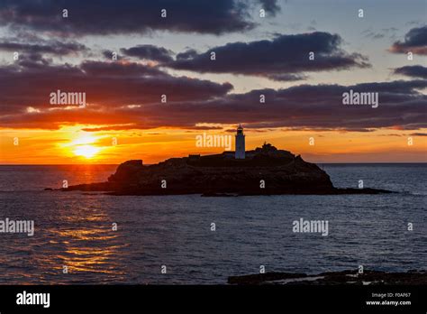 Sunset Over Godrevy Lighthouse Stock Photo - Alamy