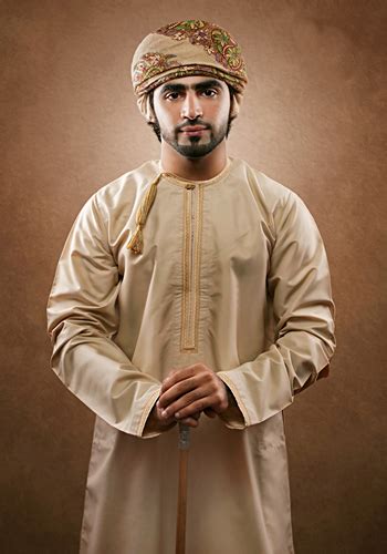 The national dress for Omani men is a simple, ankle-length, collarless ...