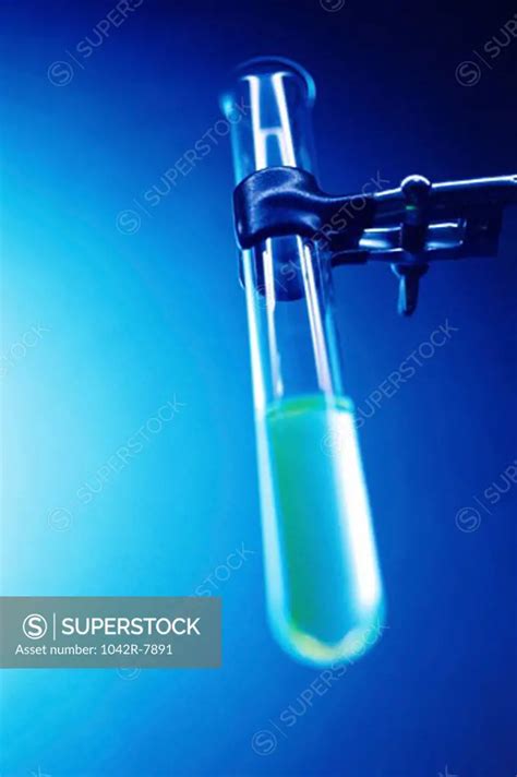 Clamp stand holding a test tube in a laboratory - SuperStock