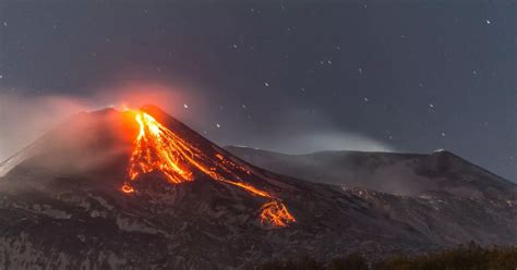 Mount Etna eruption sends lava spewing and huge column of gas into ...