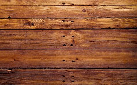 Download A Wooden Plank With Holes | Wallpapers.com