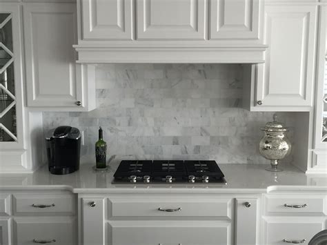 The gray in this marble tile backsplash displays just the perfect ...