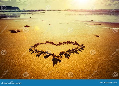 Heart of sand on the beach stock photo. Image of design - 170385108