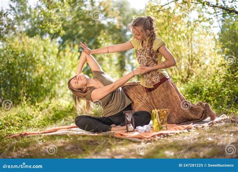 Girl Masseuse Demonstrates Refreshing Massaging Methods in a Forest ...