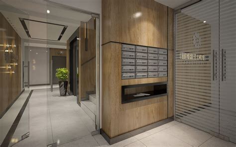 an office lobby with wooden paneling and metal mailboxes on the wall ...